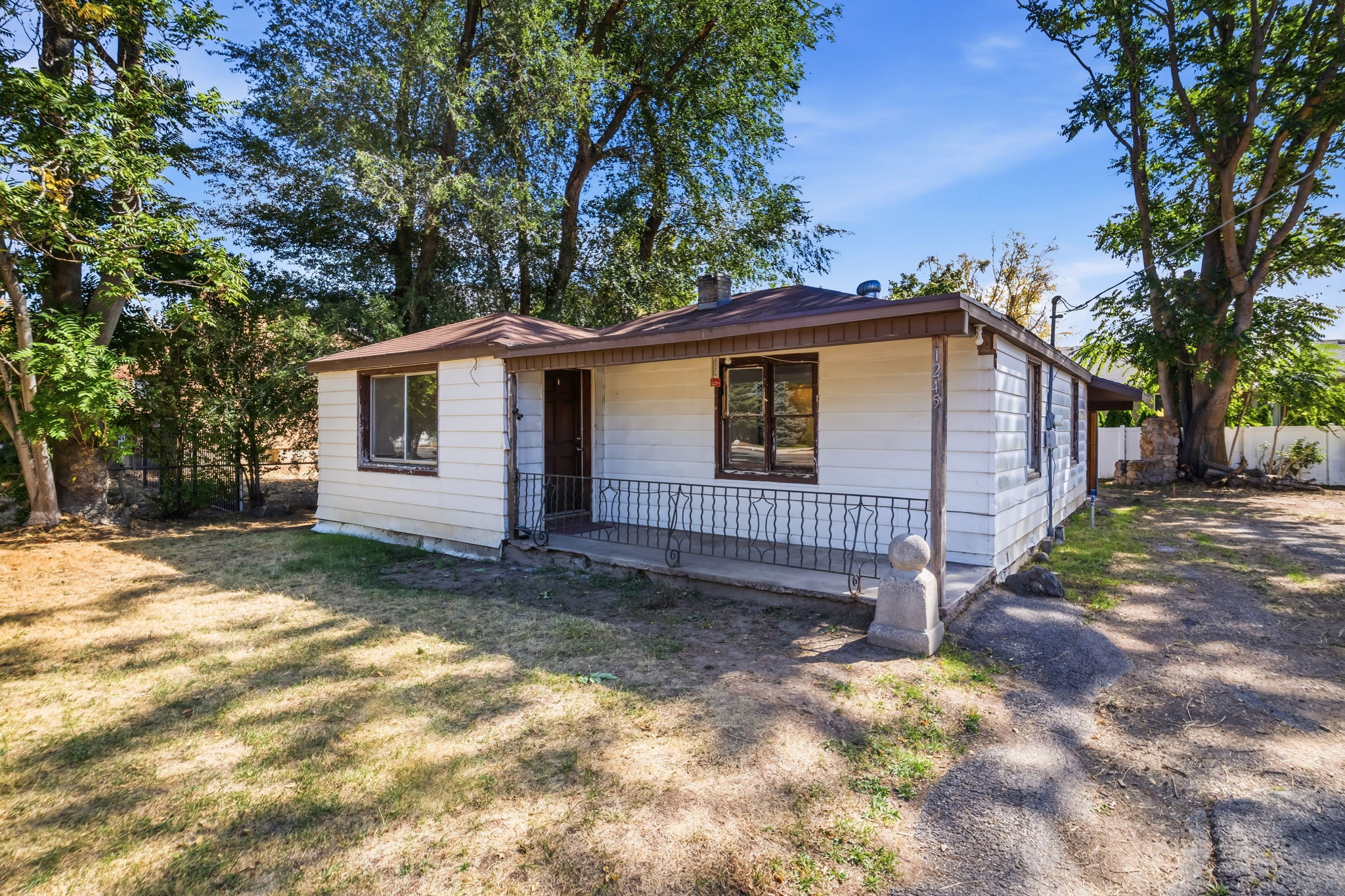 mature trees, large driveway, front porch