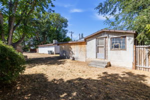 back of house in foreground, fence