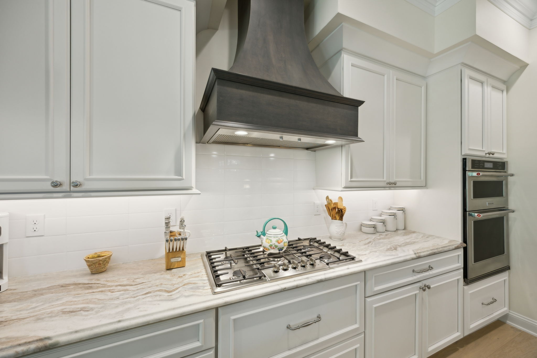 Custom Hood Vent, Gas Cooktop, Subway Tile Backsplash