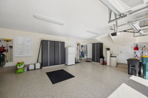 Garage - custom shelving system w/slatwell panels