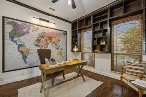 6th bedroom/Office boasts custom built ins and art adorning it's wall