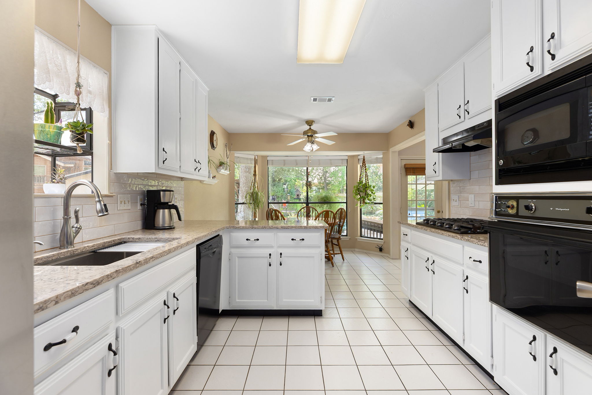 White soothing tile and view to the backyard