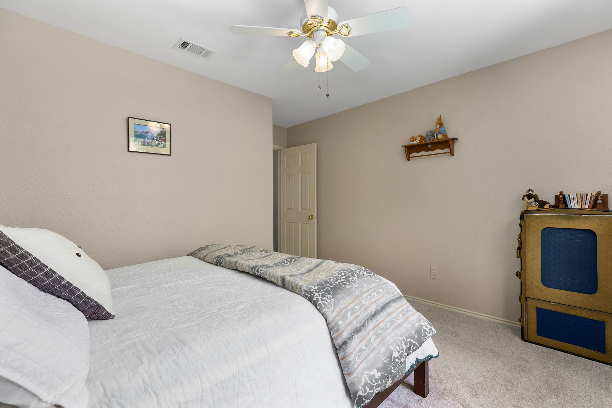 This bedroom with warm colored walls