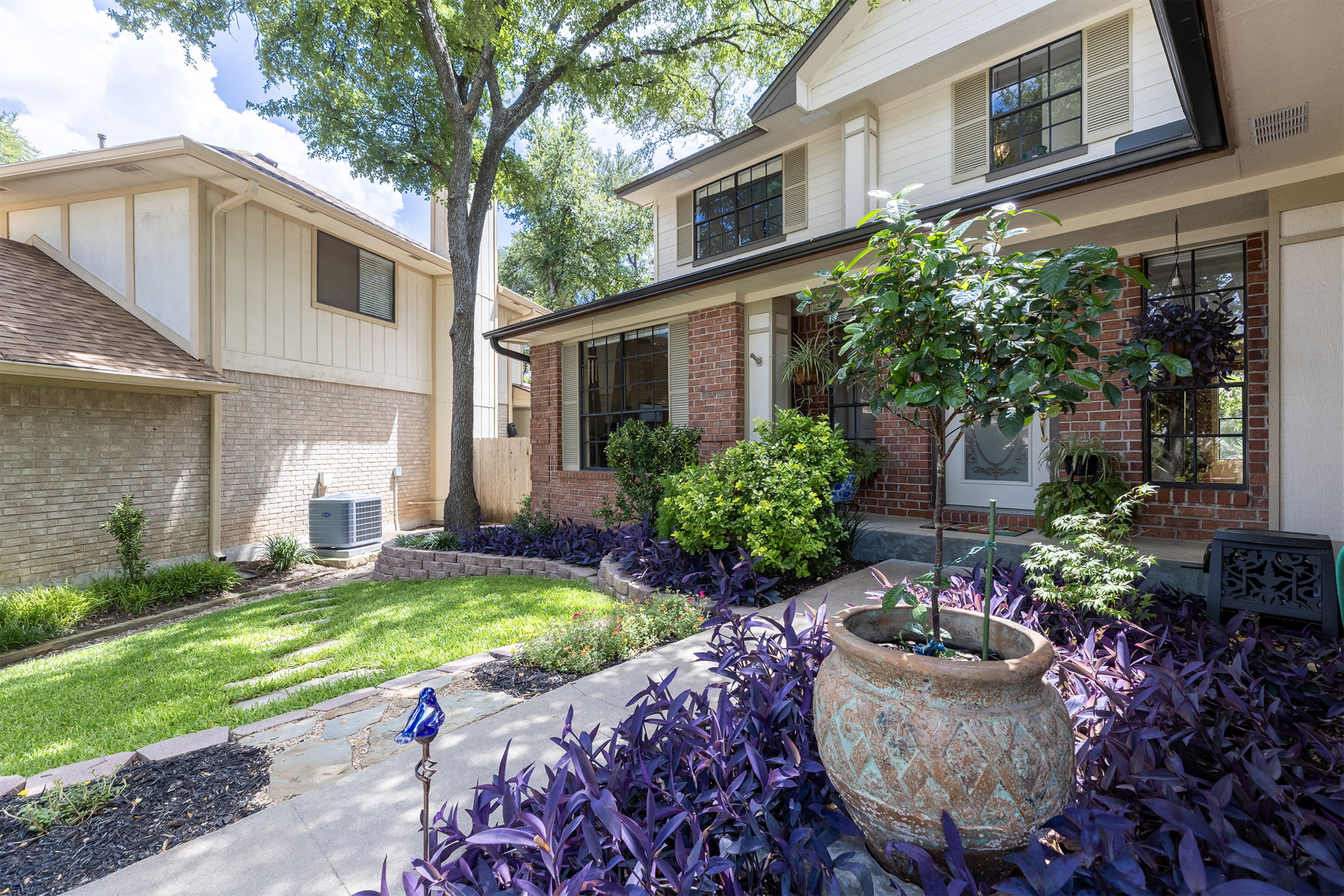 Lush plants line the walkway