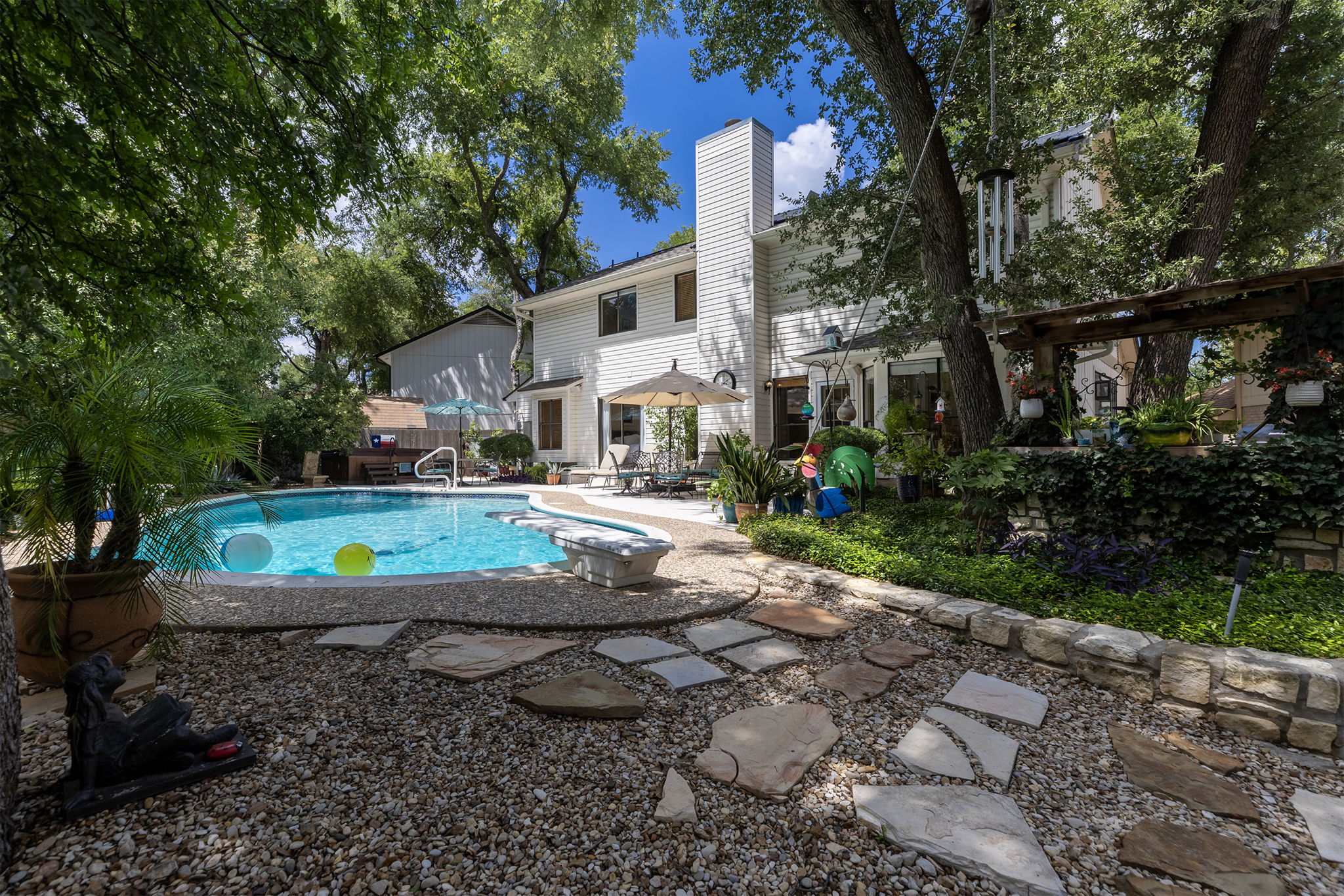 Shady backyard with walking path
