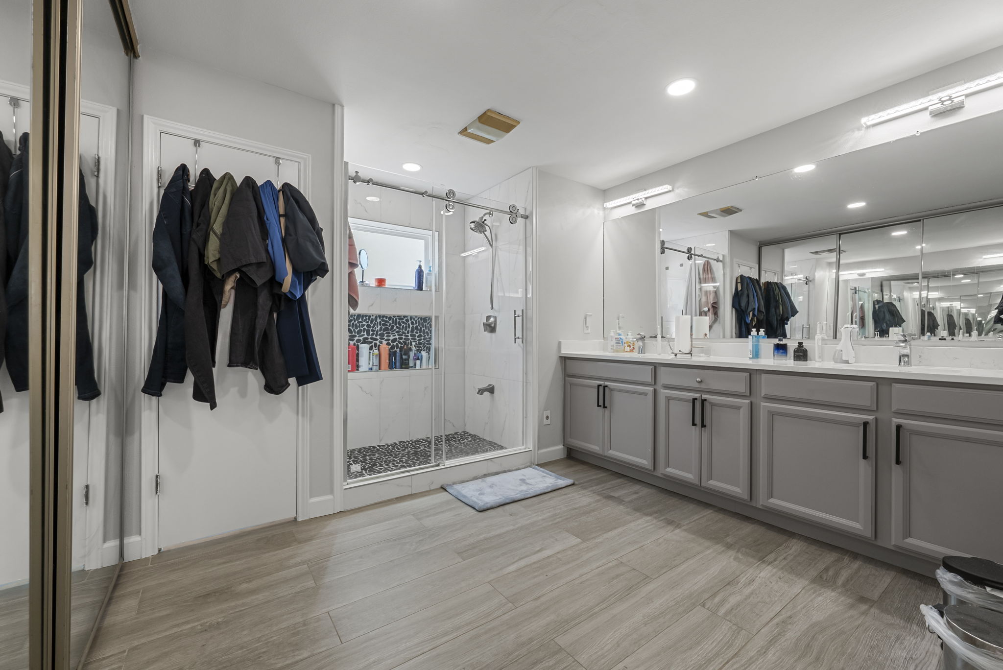 The primary bathroom is updated with a walk-in shower and dual vanities!