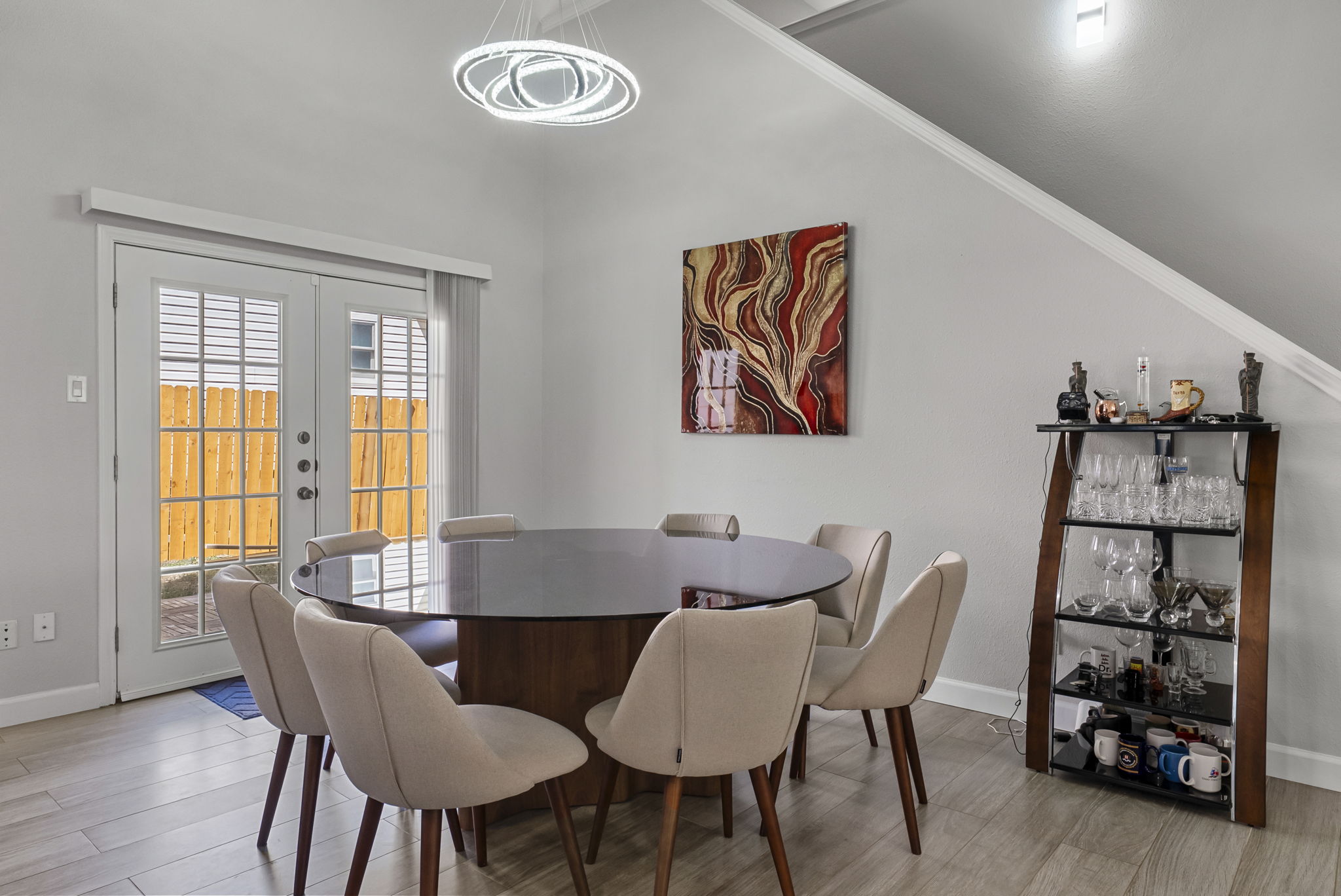 Lovely dining area with modern light fixture!