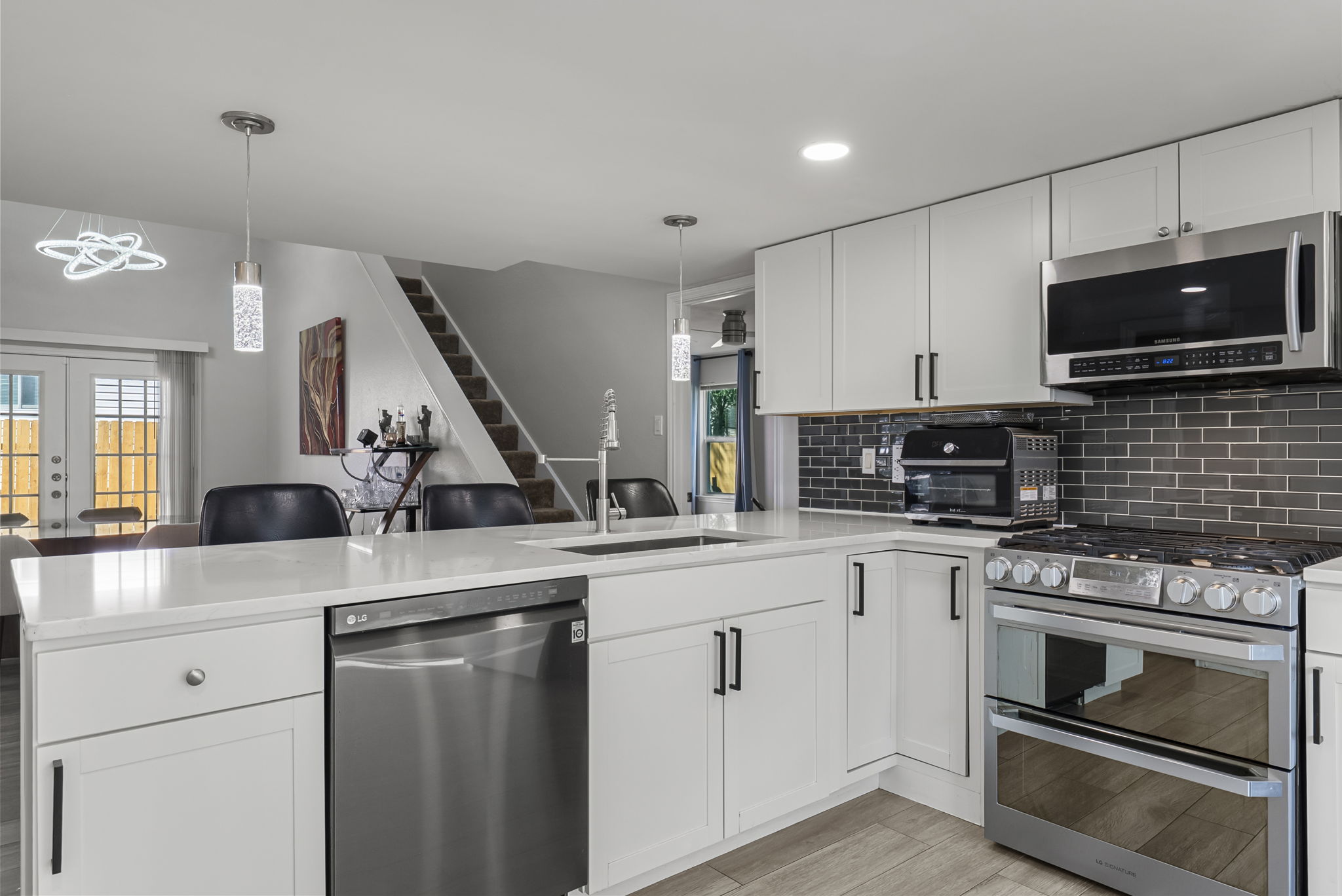View from inside the kitchen with state of the art appliances, including a refrigerator!.
