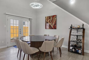 Lovely dining area with modern light fixture!