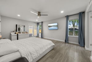 Another view of the primary bedroom, looks at all of this light!