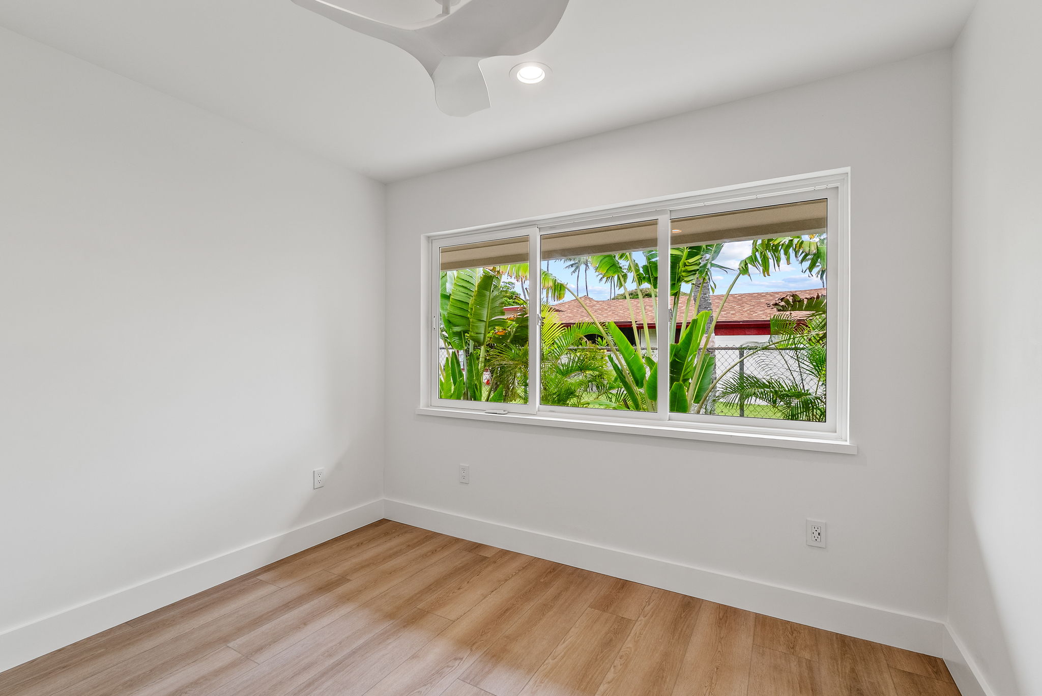 The third bedroom is adjacent to the primary bedroom and has an oversized closet.