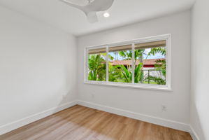 The third bedroom is adjacent to the primary bedroom and has an oversized closet.