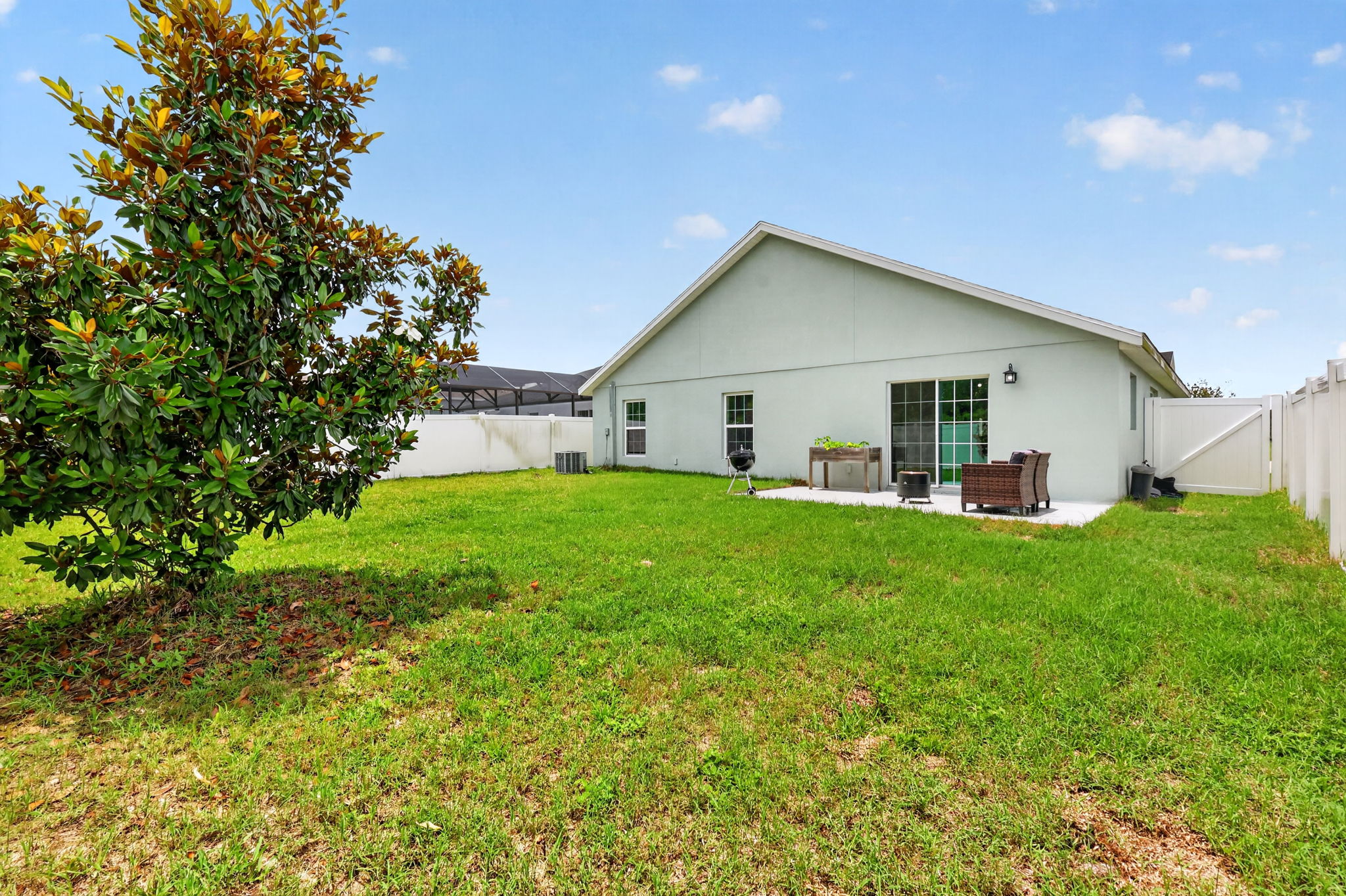 Rear Elevation with Patio, Large Fenced Yard, and Room For a Pool!