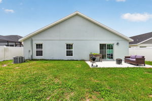 Rear Elevation with Patio, Large Fenced Yard, and Room For a Pool