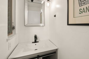 Modern Vanity in updated Half Bath located on ground floor.