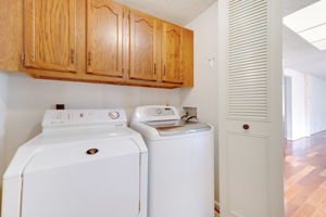 Main Level Laundry with Overhead Cabinetry