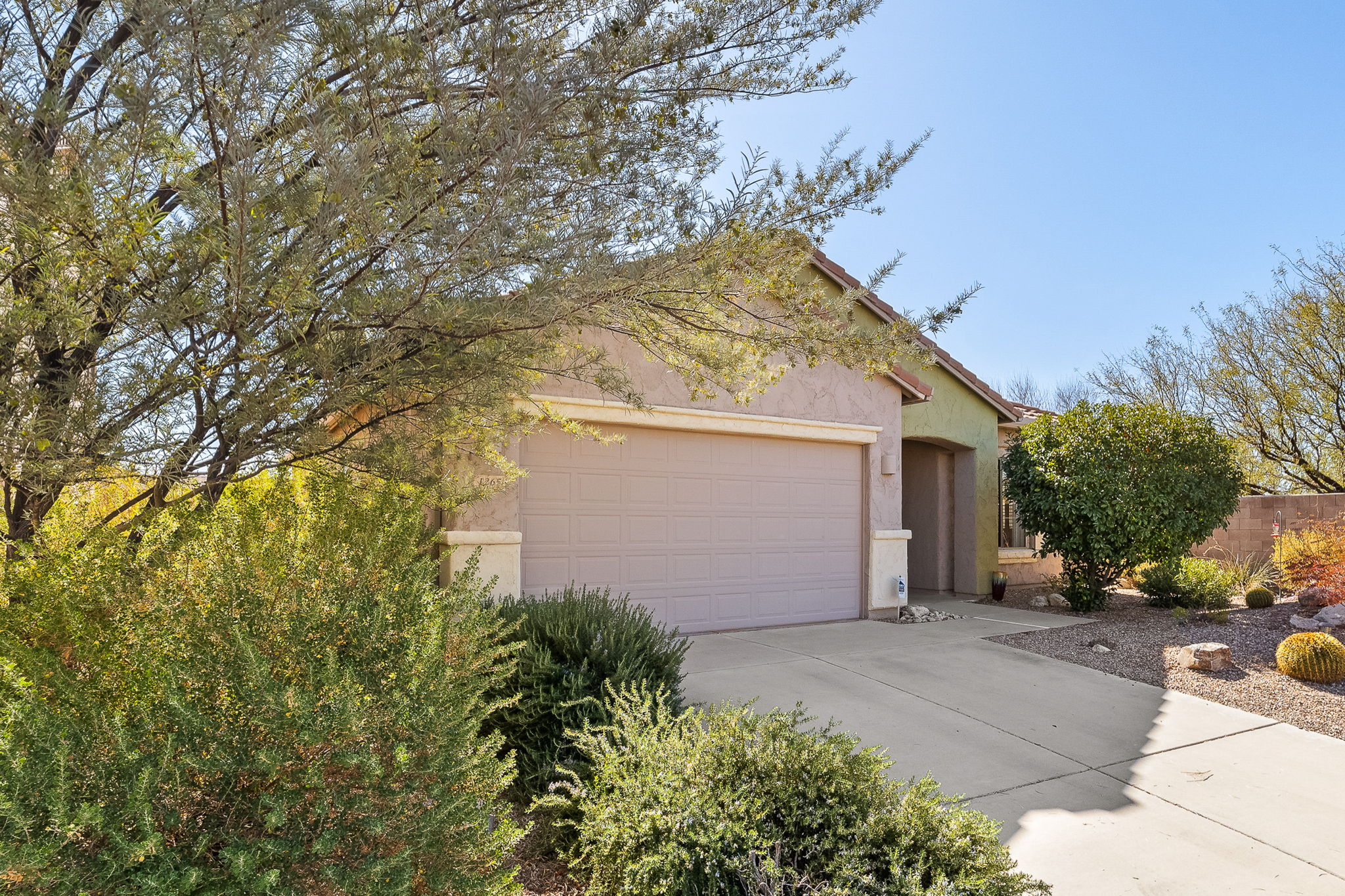 Two-car garage with concrete driveway