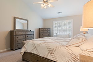 Primary bedroom w/ plantation shutters
