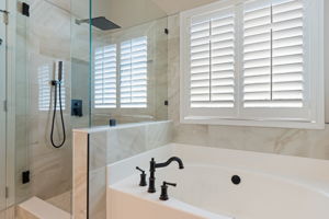 Primary bathroom with updated tile shower