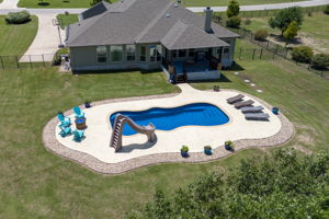 Pool is 35’ x 15’2” and holds 15,500 gallons. It’s 6’4” deep with a pool slide.