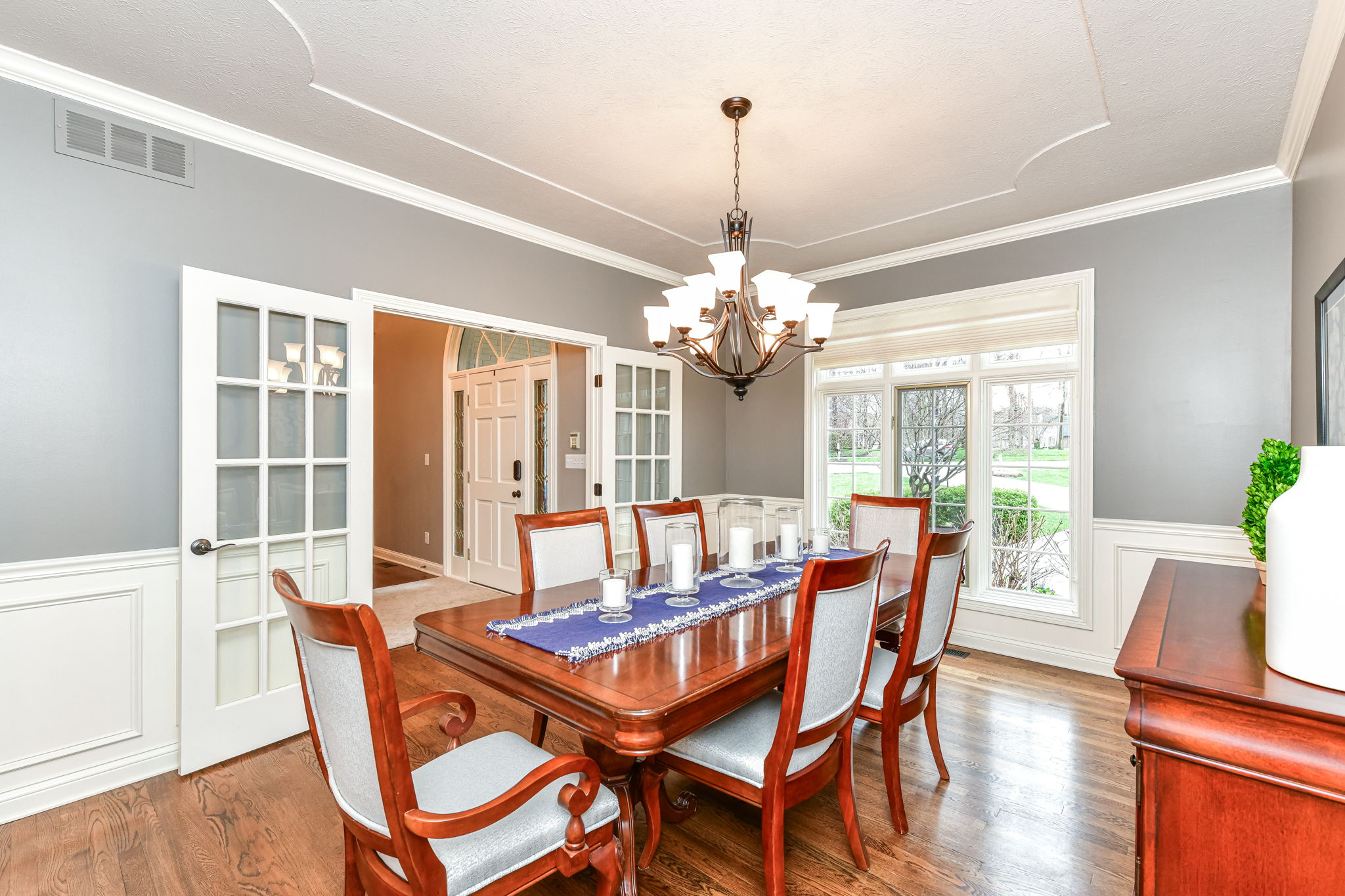 Dining Room with Crown Molding and Wainscoting