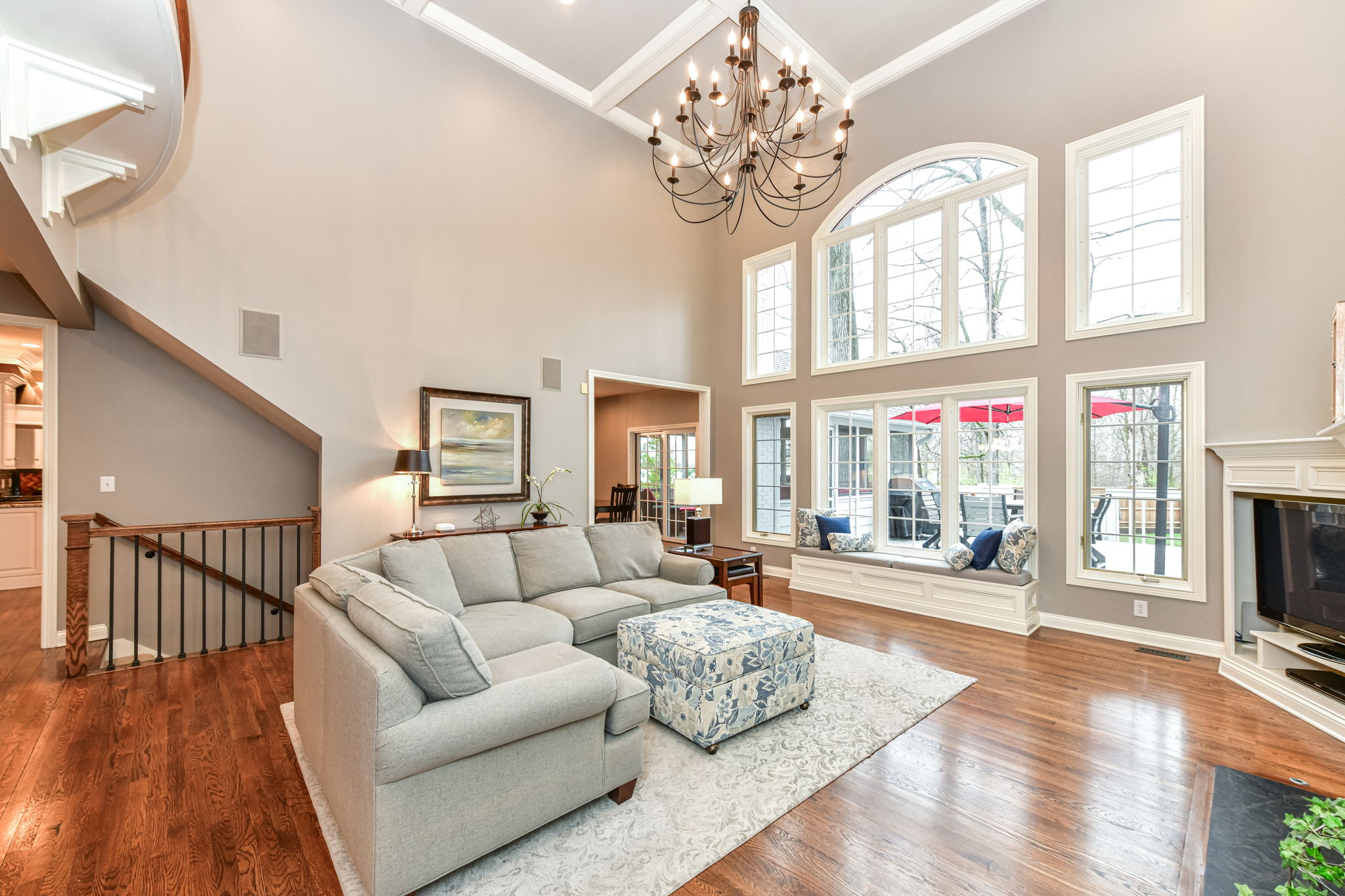 Great Room with Gorgeous Hardwood Flooring, Soaring 18' Ceiling, Fireplace and Tons of Natural Light