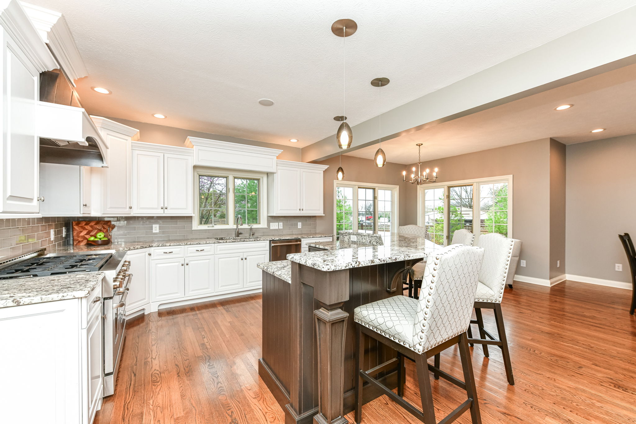 Upgraded Gourmet Kitchen with upgraded appliances and cabinets, center island and large walk-in pantry