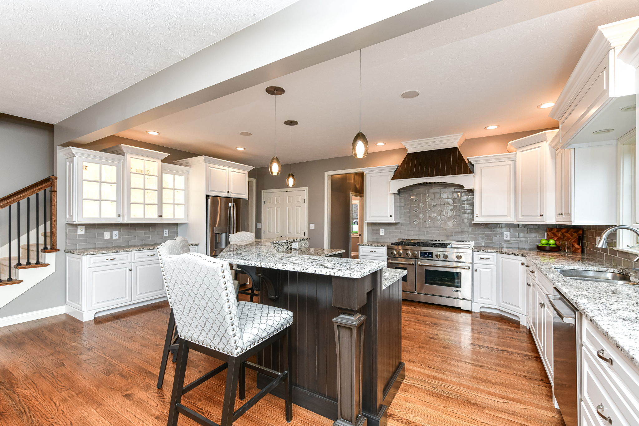 Upgraded Gourmet Kitchen with upgraded appliances and cabinets, center island and large walk-in pantry