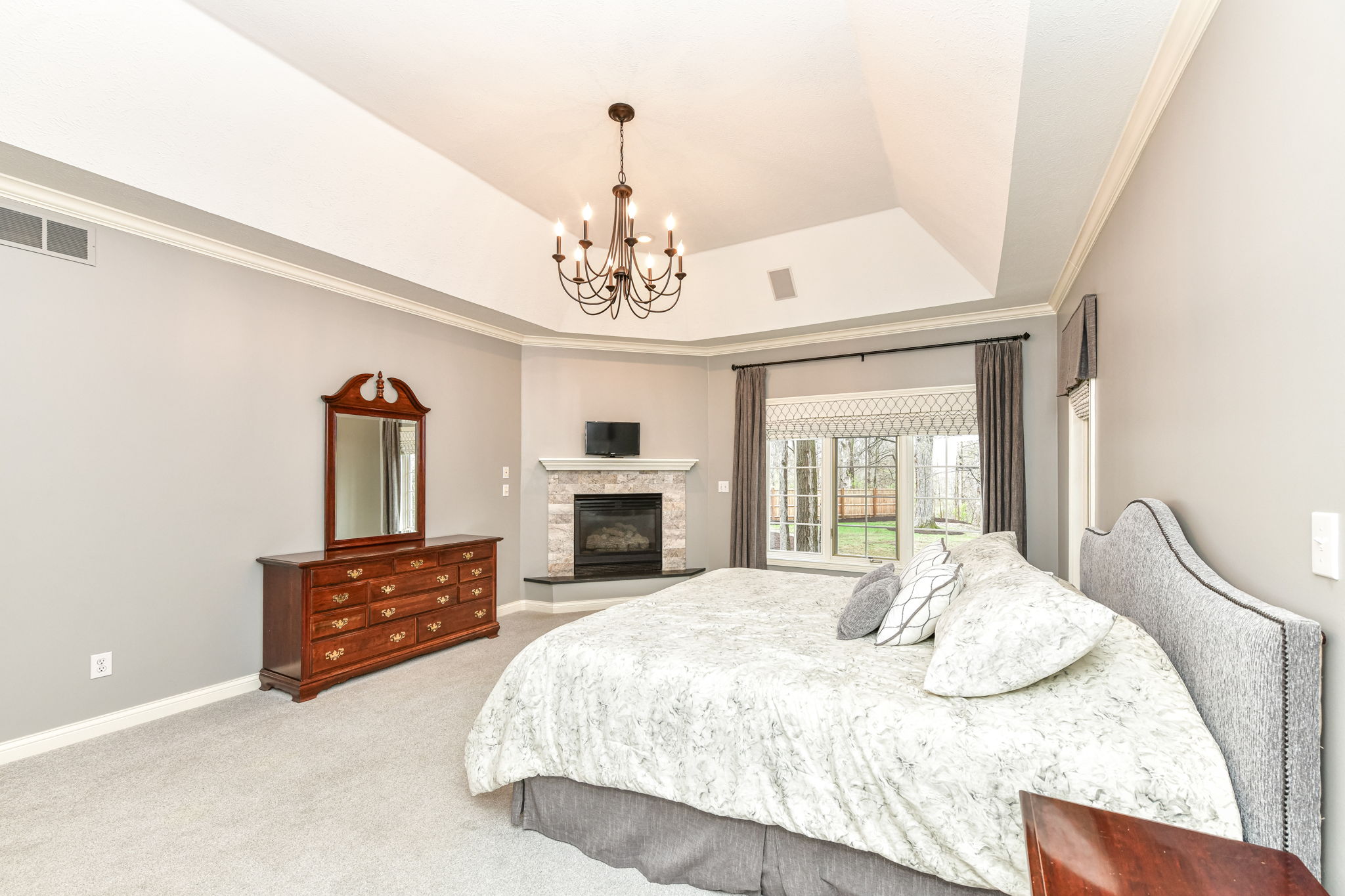 Spacious Main Level Primary Bedroom Ensuite with Cozy Fireplace