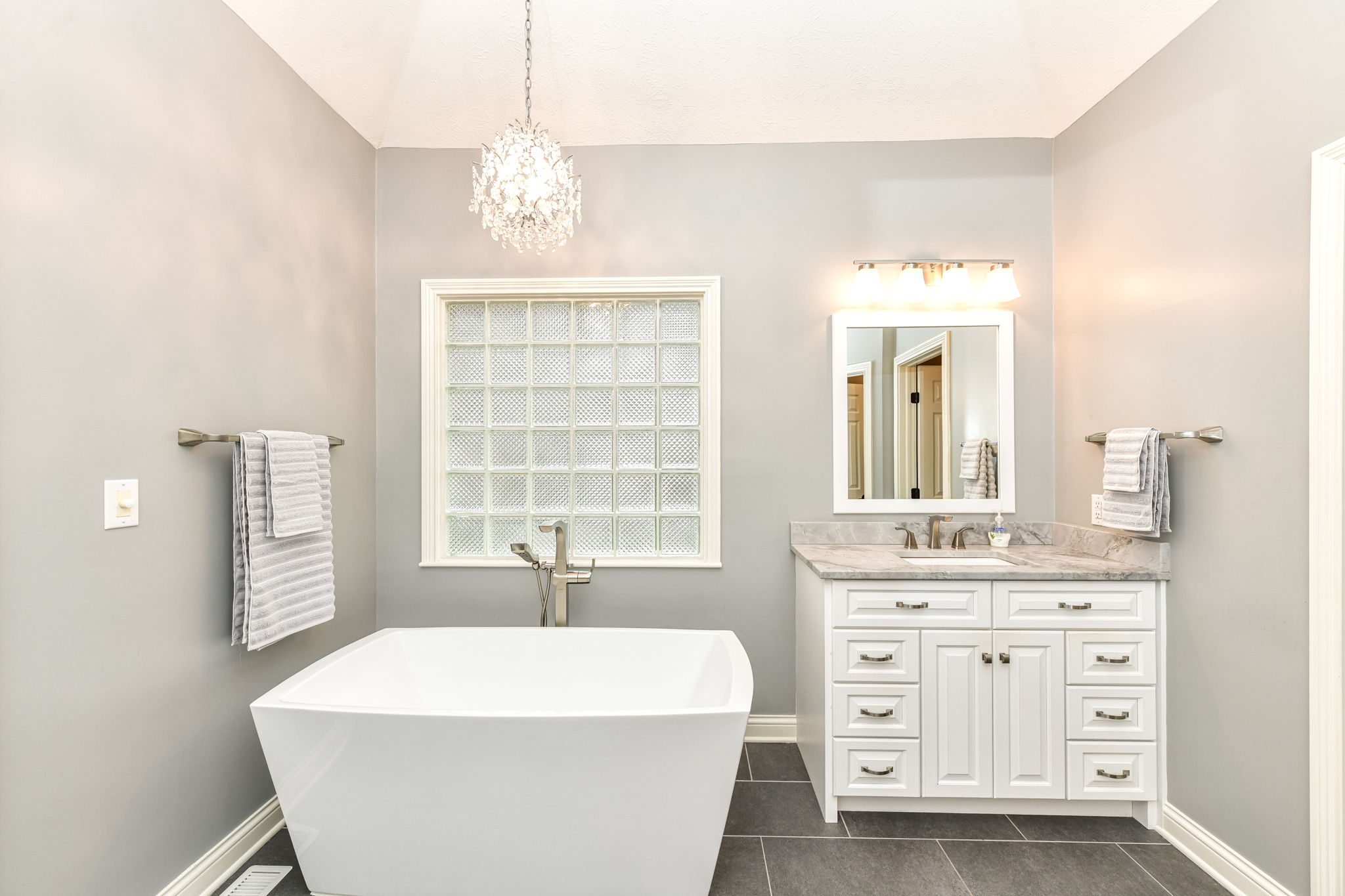 Spa-like Primary Bathroom with Beautiful Tile Floors and Large Walk-in Shower
