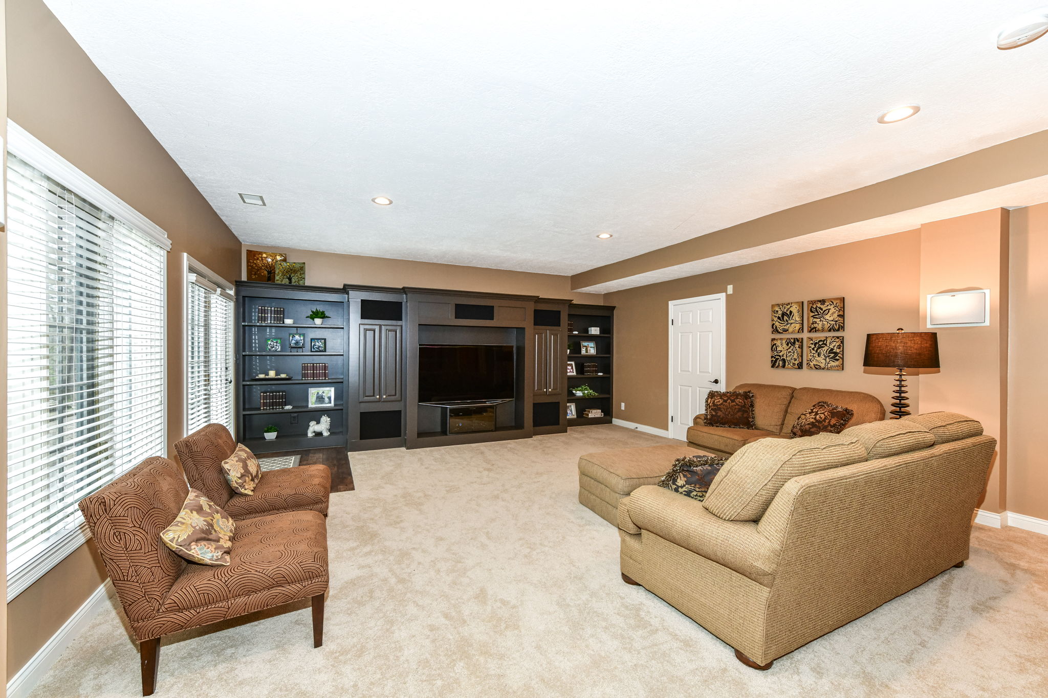 Huge Family Room in the Walk-out Lower Level with Custom Entertainment Center