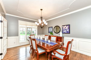 Dining Room with Crown Molding and Wainscoting