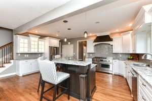 Upgraded Gourmet Kitchen with upgraded appliances and cabinets, center island and large walk-in pantry