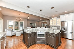 Upgraded Gourmet Kitchen with upgraded appliances and cabinets, center island and large walk-in pantry