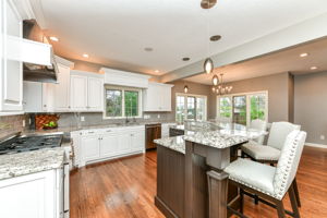 Upgraded Gourmet Kitchen with upgraded appliances and cabinets, center island and large walk-in pantry