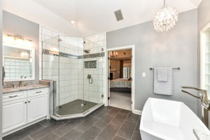 Spa-like Primary Bathroom with Beautiful Tile Floors and Large Walk-in Shower