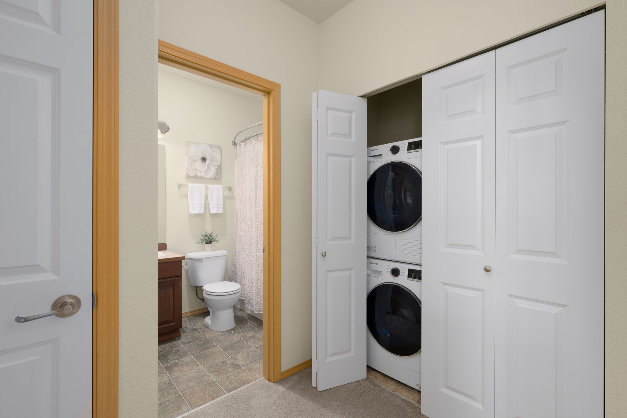 Laundry room is tucked away in hall closet