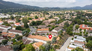 Aerial view looking approx southwest over unit and community