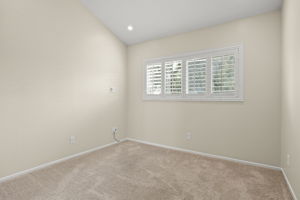 BR #3 on mid-level has mirrored closet doors, plantation shutters, vaulted ceiling & recessed lighting.