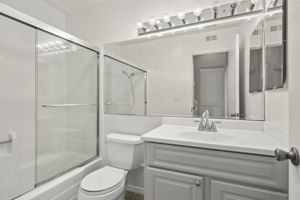 Mid-level full bath with tile flooring and shower/tub is adjacent to BRS #2 & 3