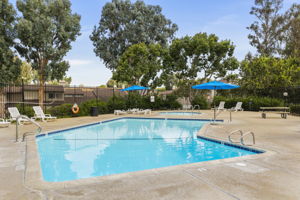 Community's main pool and spa area adjacent to clubhouse, tennis court, basketball/sport court