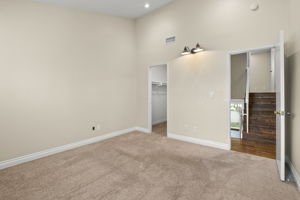 BR #2 on mid-level has large walk in closet, plantation shutters, vaulted ceiling & recessed lighting.