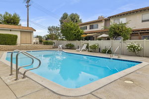 View from over pool towards unit's front private gated yard.