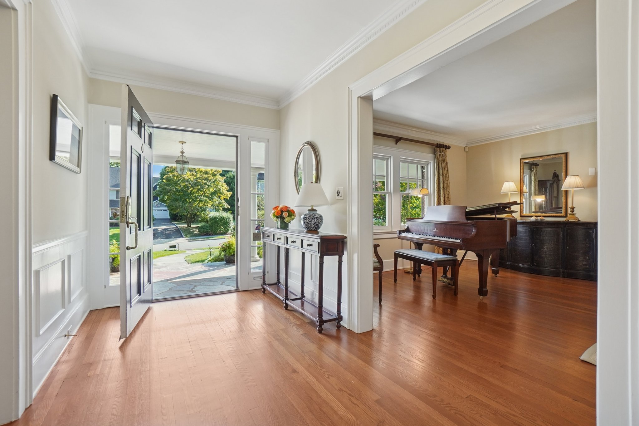 Step inside and exhale-the city fades, and home begins. This welcoming entry hall sets the tone for suburban living at its best: peaceful, connected, and beautifully yours at the end of every commute.