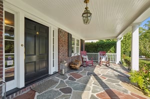 Front porch living at its best: Sunday papers, a glass of rosé at dusk, or spontaneous chats that turn into friendships.