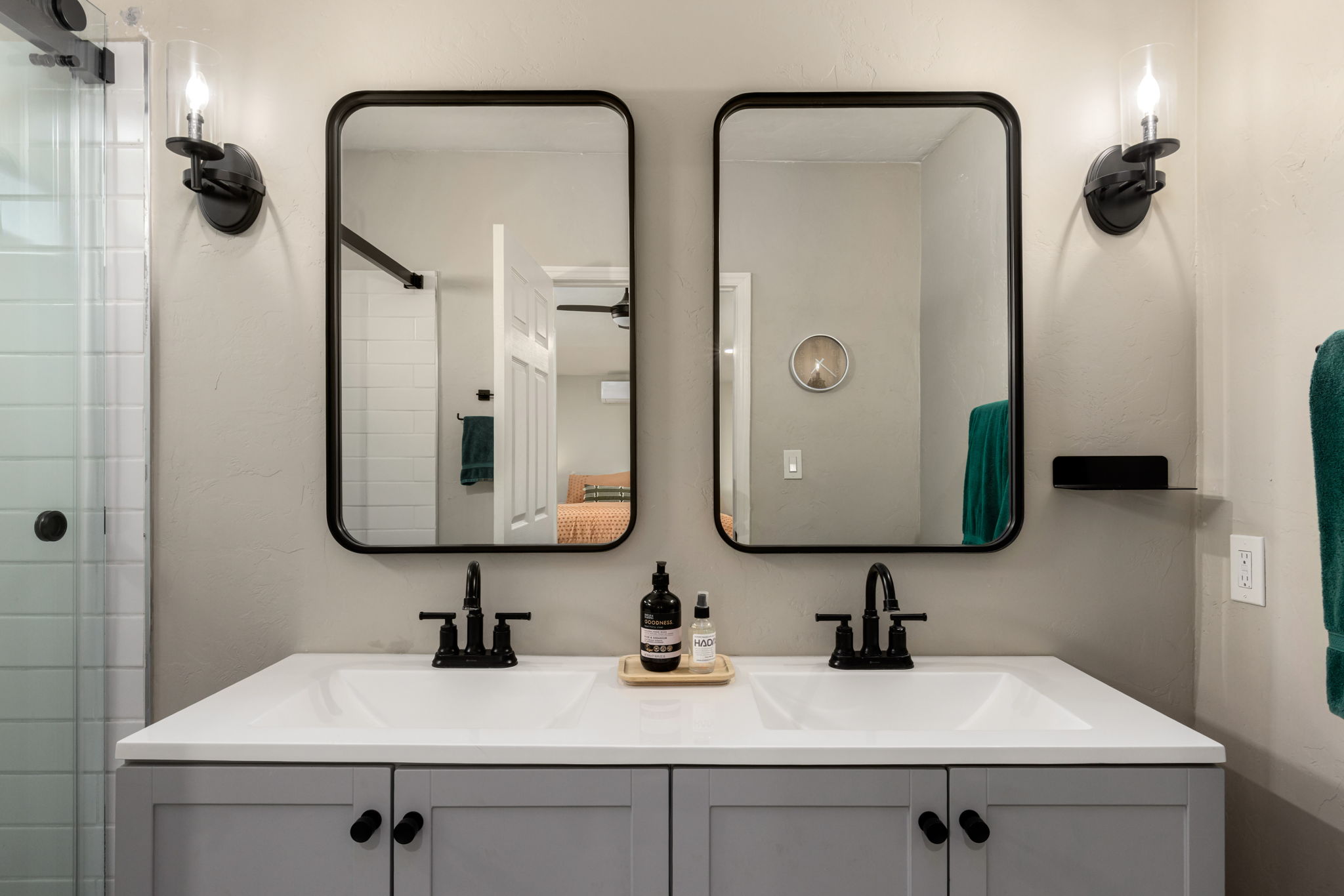 Updated primary bathrooms with double sink vanity.