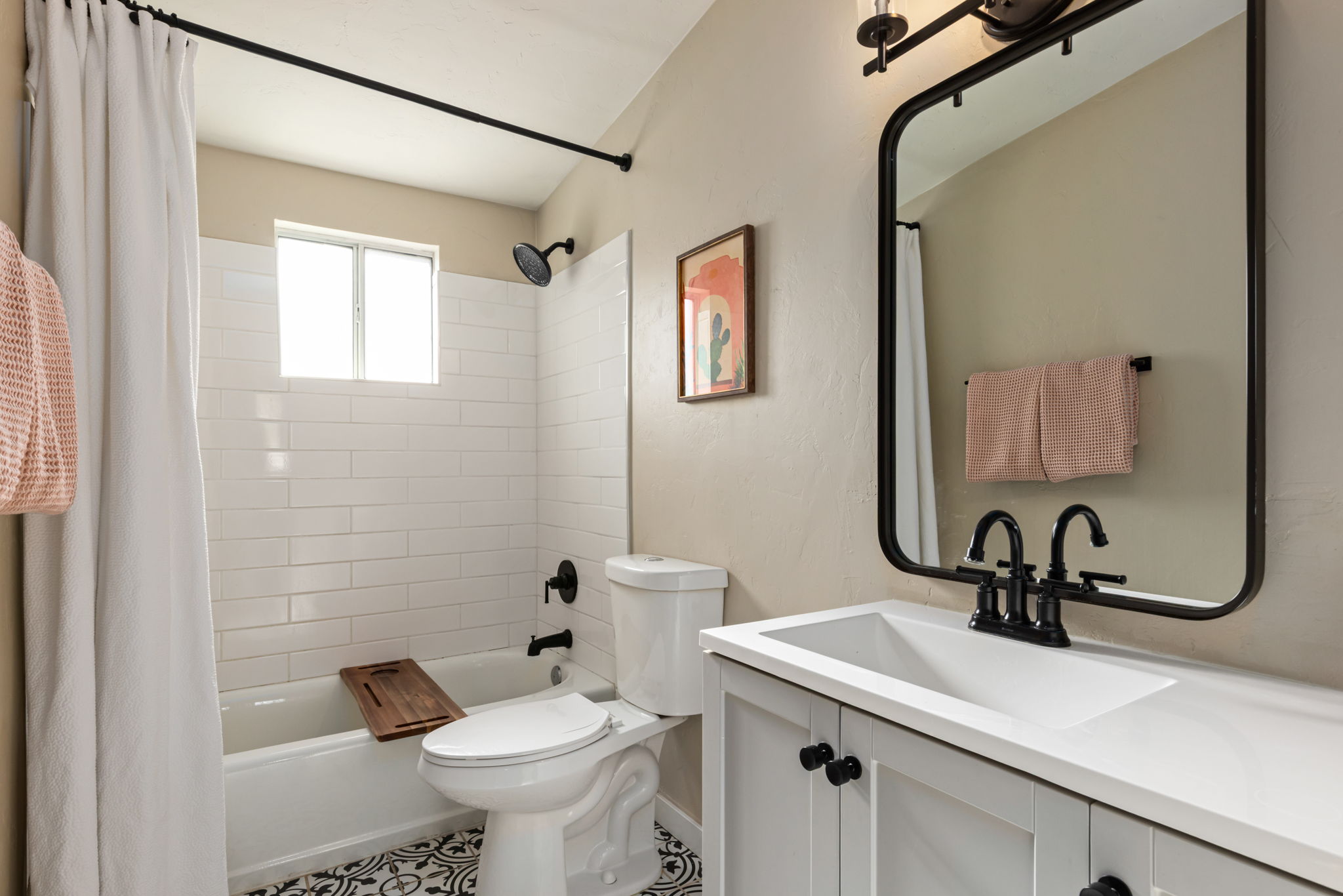 Updated guest bathroom with shower and tub.
