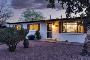 Burnt adobe with stucco finish exterior.