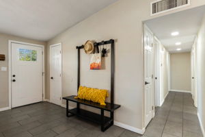 Hallway leading to bedrooms  2, 3 and 4- which has an ensuite bathroom. Plus the guest bathroom is down the hall.