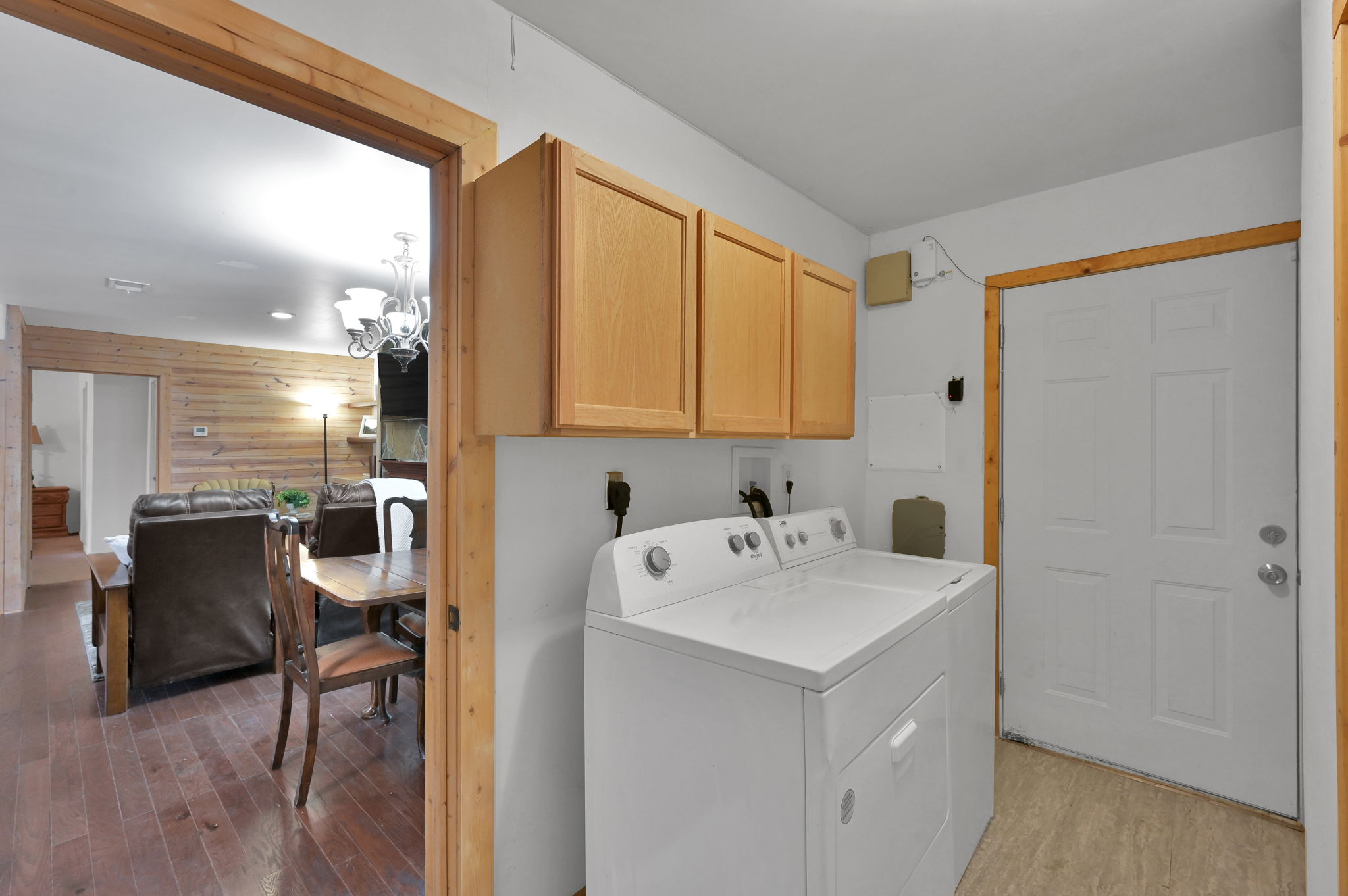 UTILITY ROOM w/ storage area above. Tankless H20 Heater is located in this room. Washer & Dryer included in the sale.